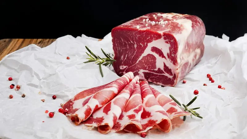 Raw pork cuts resting on white butcher paper