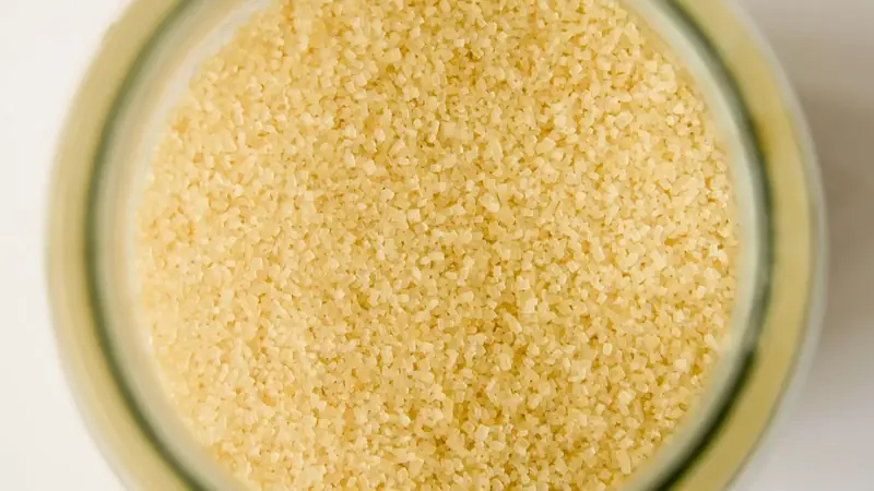 Bowl of soft, moist brown sugar viewed from above