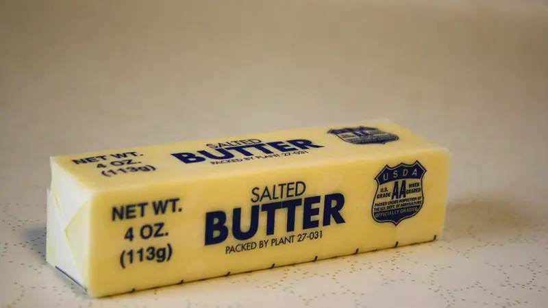 Wrapped stick of salted butter showing the stick of butter in tablespoons markings