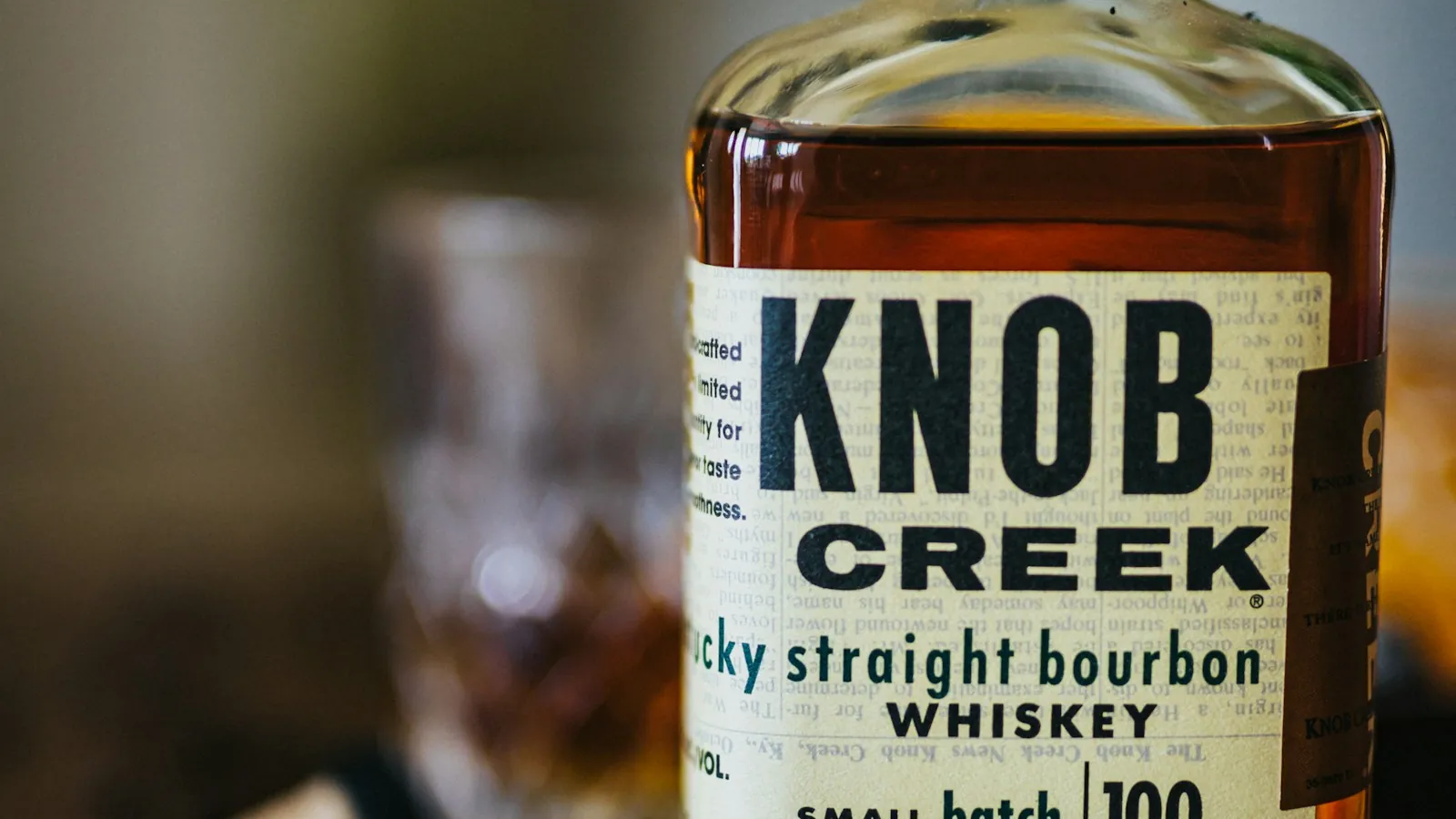 Bottle of Knob Creek bourbon whiskey sitting on a table